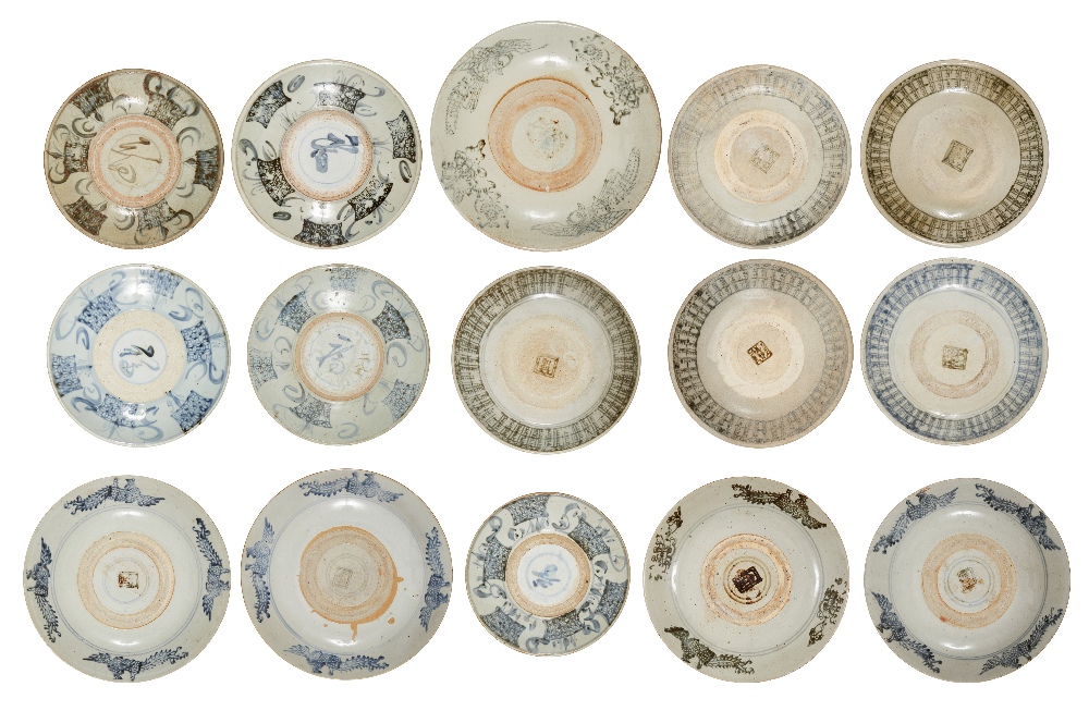 A group of fifteen large Chinese 'Zhangzhou' blue and white plates, 17th to 19th century,