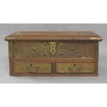 A teak Zanzibar chest, early 20th century, brass mounted, the hinged compartment enclosing candle