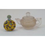 A Chinese enamelled Peking glass snuff bottle and a rock crystal teapot, 20th century, the snuff