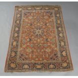 A Persian Kashan rug, 20th century, central floral medallion surrounded by floral motifs and