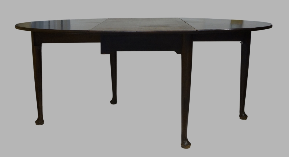 A mahogany drop leaf dining table, 19th century, raised on cylindrical tapering supports to pad - Image 2 of 3