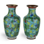 A pair of Chinese cloisonne baluster vases, 20th century, decorated with foliage to a blue ground,