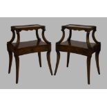 A pair of two tier mahogany tables, with single drawer, raised on reeded sabre legs, possibly from