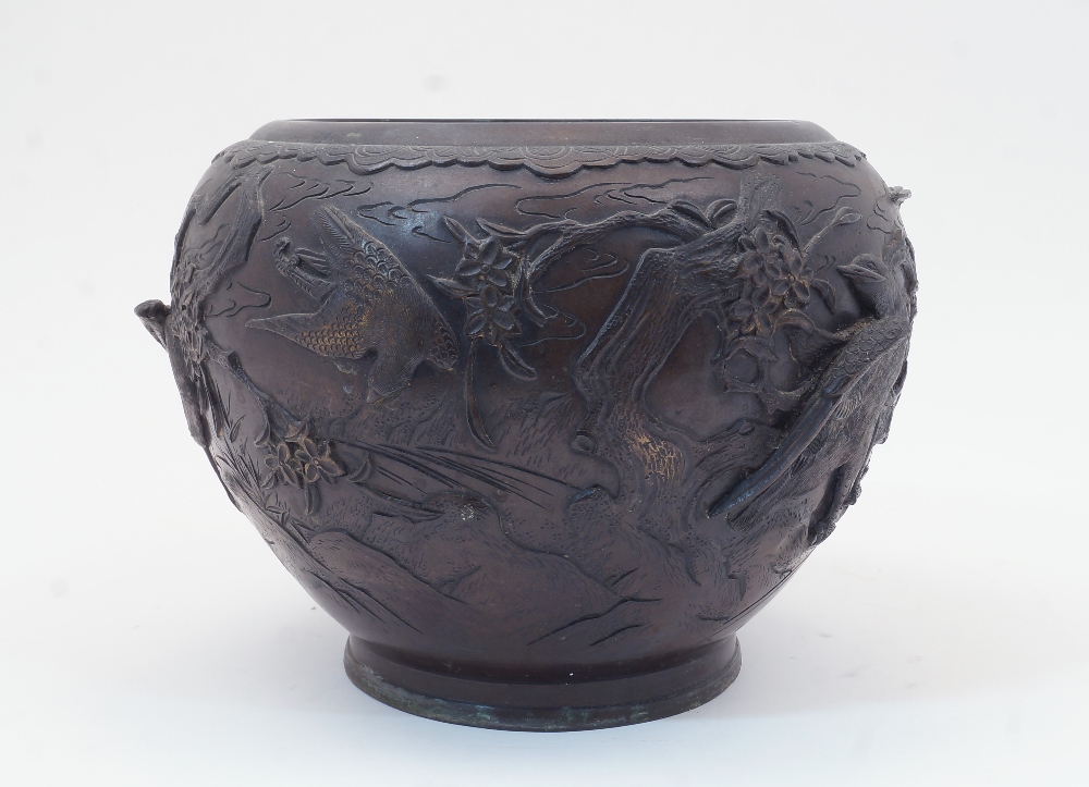 A Japanese bronze bowl, Meiji period, late 19th / 20th century, cast with high relief birds and