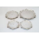 Four silver salvers, comprising: an Edwardian salver, Sheffield, 1909, William Hutton & Sons Ltd.,