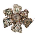 A collection of six 'Sweet Heart' pin cushions, 19th century, each decorated with a regimental