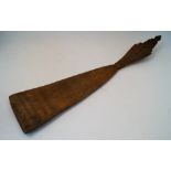 A Russian carved wood distaff or wool winder, 19th century, the paddle intricately carved with