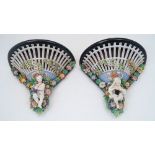 A pair of German porcelain wall brackets, 19th century, of pierced trellis design with encrusted