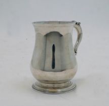 A George III silver mug, London, 1771, probably William Grundy, with acanthus leaf handle on stepped
