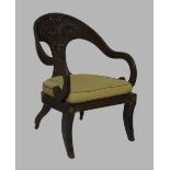 A French mahogany scroll armchair, late 19th/early 20th century, with carved backrest and caned