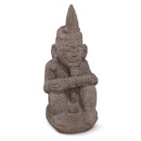 A Nias Island carved stone Gowe Ni'oniha ancestor figure, Indonesia, 20th century, depicting a