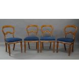 A set of seven Victorian oak hoop-back dining chairs, each with kidney-shaped splat to the