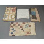 A group of quilts and spreads, late 19th / 20th centuries, decorated with geometric and floral