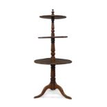 A George III mahogany three tier dumbwaiter, possibly Irish, with turned finial and column supports,