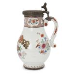 A Chinese famille rose silver-mounted baluster jug, Qianlong period, painted with flowering shrubs