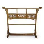 A Chinese elm screen, early 20th century, the top stretcher with carved end finials, above three