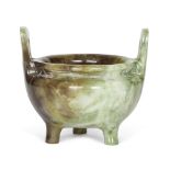 A Chinese green hardstone archaistic censer, mid-20th century, with high loop handles raised on