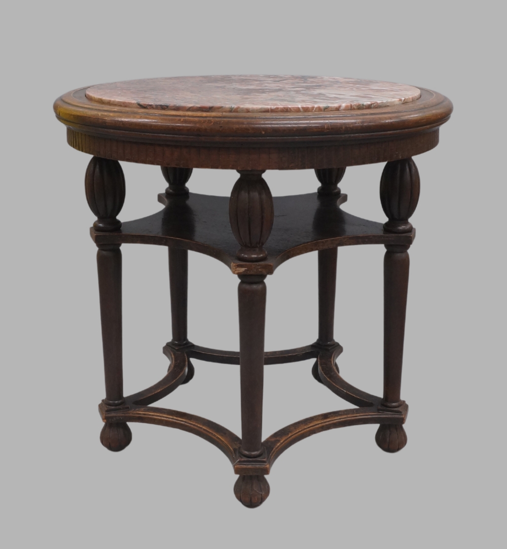 A French oak centre table with marble top, late 19th century, raised on five reeded baluster and