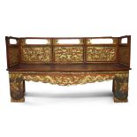 A Chinese gilt lacquered opium bed, early 20th century, with solid bed panel, carved to the railings