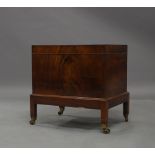 A George III mahogany cellaret on stand, ebony strung, raised on square legs to brass caps and