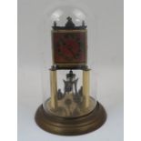 A brass anniversary clock, 20th century, with an adjustable four ball rotary pendulum, the square