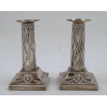 A pair of Edwardian Adam Revival silver candlesticks, London, 1901, Thomas Bradbury & Sons, of