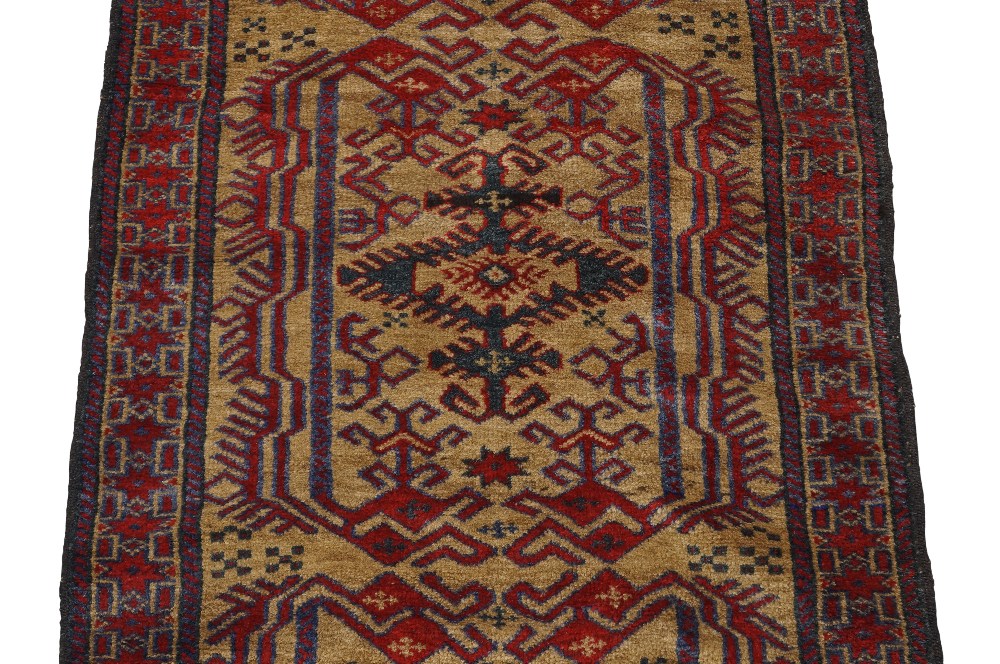 An Afghan Belouch runner, 20th century, repeating geometric motifs, on a beige ground, contained - Image 2 of 3