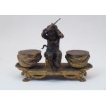 An ormolu double inkwell, probably French, early 19th century, the centrally seated winged