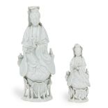 Two Chinese Dehua 'Blanc-de-Chine' figures of Guanyin, 18th century, each similarly modelled