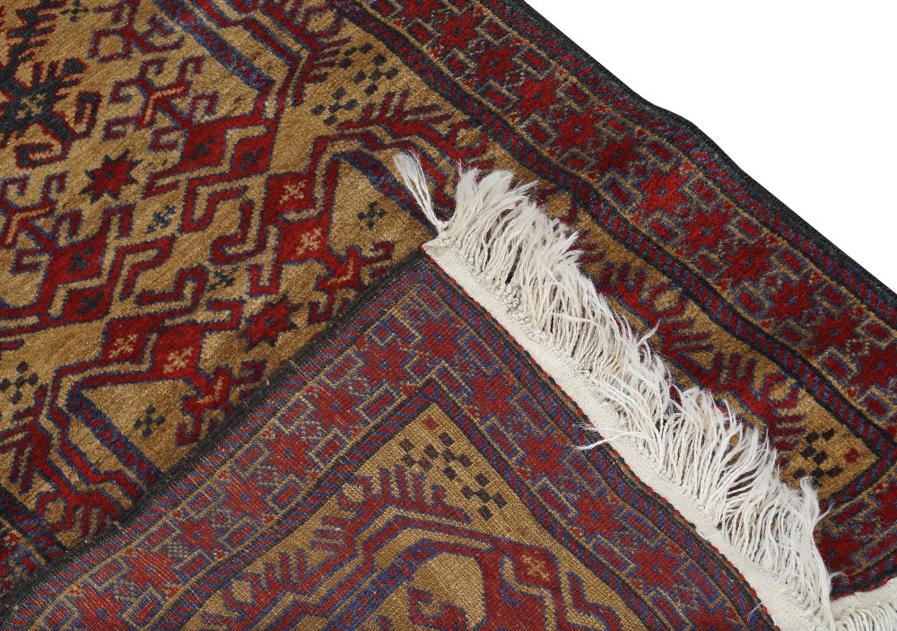 An Afghan Belouch runner, 20th century, repeating geometric motifs, on a beige ground, contained - Image 3 of 3