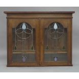 Art Nouveau oak and glazed wall mounted bookcase, early 20th Century, formerly the top section to