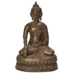A Nepalese bronze Buddha, 18th century, cast sitting on a waisted lotus base in Bhumisparsha