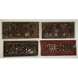 Four Chinese carved wood rectangular panels, 20th century, to include three with a white frame,