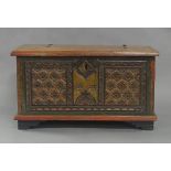 An Indian painted teak trunk, early 20th century, the front with floral carvings, the hinged lid