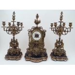 A gilt-brass clock garniture, by H. Luppens et decoration, flanked by five light candelabra, all
