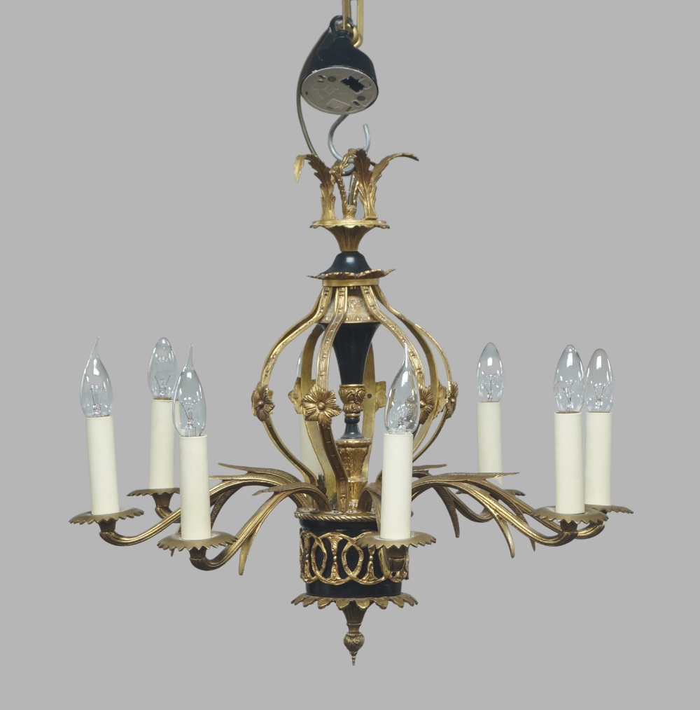 A gilt and patinated bronze eight-light chandelier, late 20th century, the open cagework body