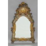 A Venetian style carved and polychrome painted wall mirror, second half 20th century, of arched