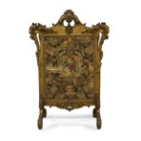 A large French giltwood fire screen, 19th century, with central silk stump work panel, below