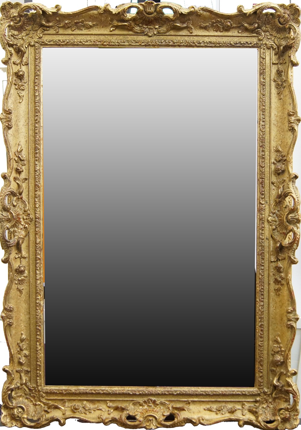 An English Gilded Composition Swept and Pierced Regence Style Frame, late 20th century, with cavetto