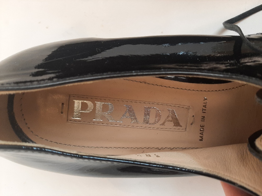 Prada: a pair of black patent leather lace up shoes, size '38.5', with gilded logo to insole and - Image 17 of 52