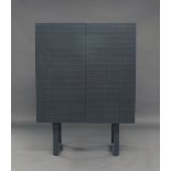 A contemporary cabinet on stand, of recent manufacture, in grey painted wood, with two cupboard