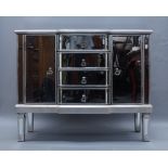 A contemporary breakfront mirrored side cabinet, with four central drawers flanked by two cupboard