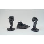 After Alexandre Clerget, French, 1865-1931, two pewter figural candlesticks, each modelled as a