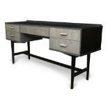 An ebonised desk, upcycled by Ruby Rhino, the rectangular top above an arrangement of five grey