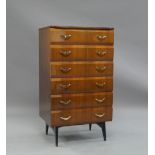 Meredew, a lacquered Afromosia chest of drawers, c.1960, with six drawers, on tapered ebonised