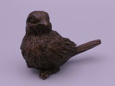 A bronze model of a bird. 4 cm high.