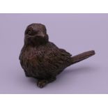 A bronze model of a bird. 4 cm high.