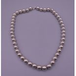 A ladies Tiffany silver bubble necklace, with UK Tiffany hallmarks on chain. 44 cm long. 47.