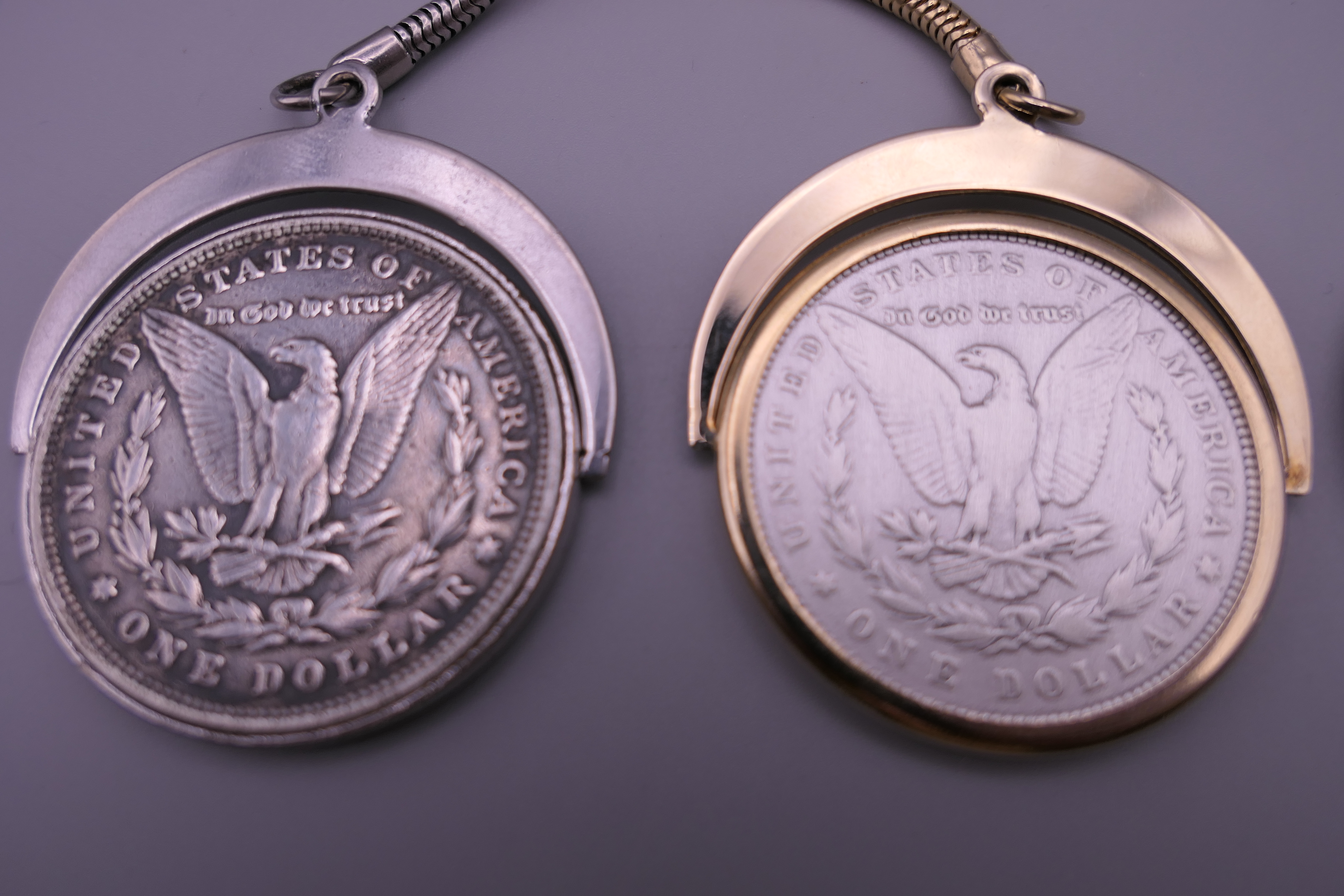 Two 1880 silver dollars each set as a keyring and a 1974 one dollar coin. - Image 3 of 5