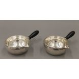 A pair of Georg Jensen sterling silver sauce ladles. Each 16.5 cm long.